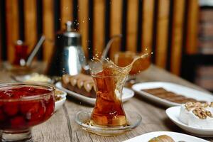 Wooden Table Displaying Plates of Food photo