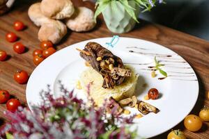 Delicious Plate of Food on a Rustic Wooden Table photo