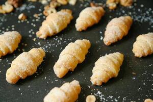 Assorted Croissants Arranged on a Baking Pan photo