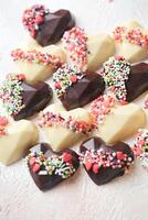 Assorted Heart-Shaped Chocolates Arranged on a Table photo