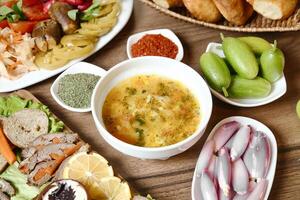 Wooden Table Displaying Assorted Food Bowls photo