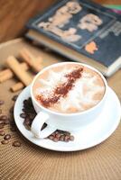 Steaming Cup of Hot Chocolate With a Sprinkle of Cinnamon on a Saucer photo