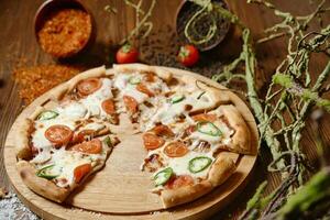 Pizza on Wooden Cutting Board photo