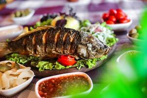 Delectable Plate of Food With Freshly Cooked Fish photo