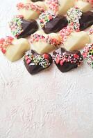Assorted Heart Shaped Chocolates Adorning a Table photo