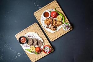 Two Plates of Food on Table photo