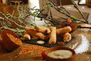 Wooden Table Displaying a Variety of Delicious Food photo