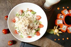 Plate of Food on Table Next to Glass of Milk photo