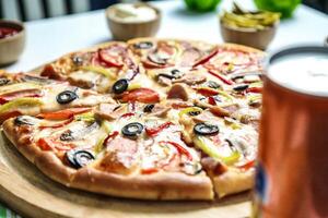 Delicious Pizza and Beer on Wooden Table photo