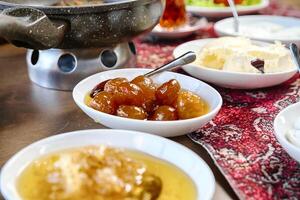 Table Adorned With Assorted Bowls of Food and Ice Cream photo