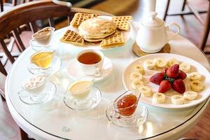 Table With Fruit and Waffles photo