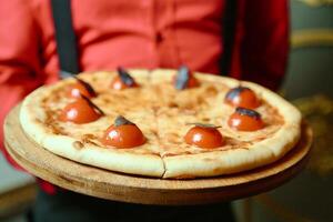 Person Holding a Tomato Pizza photo