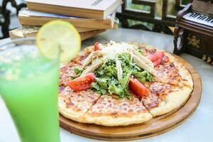 Pepperoni Pizza on Wooden Cutting Board photo