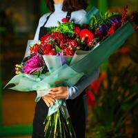 Woman Holding Bouquet of Flowers photo