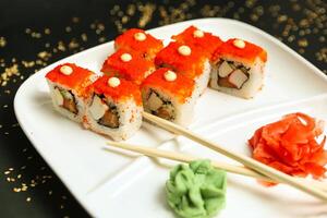 White Plate With Sushi and Chopsticks photo