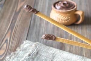 Breadsticks with chocolate cream photo