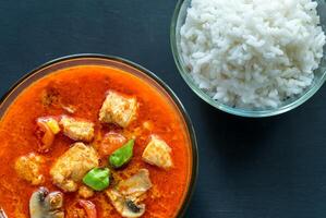 Thai red chicken curry with white rice photo