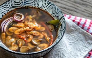 Bowl of thai tom yum soup photo