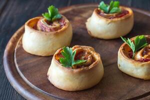 Pizza rolls on the wooden board photo