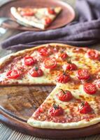 Pizza with cherry tomatoes and mozzarella photo