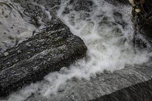 The stream of water. Water texture. photo