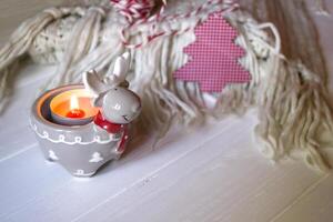 Burning candle and christmas decoration. photo