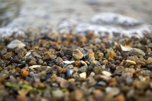 The small pebble macro shot. Small stones background. photo