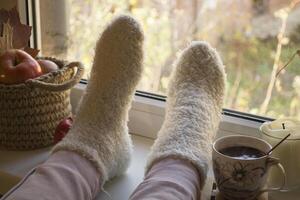 Woman relaxing with cup of coffee at home. photo