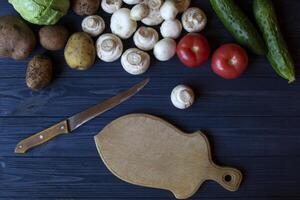 Vegetables on a rustic table. Organic ingredients for cooking. photo