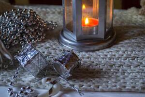 Burning candle and christmas decoration. photo