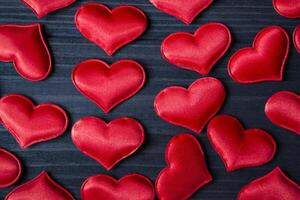 Red love hearts on a blue wooden background. Valentine's Day 2019. Background for greeting card. photo