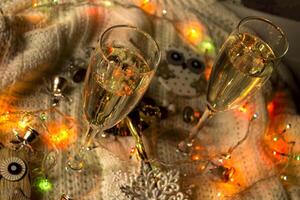 The glasses of champagne and christmas decoration. photo