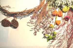 Dried flowers on a desk. The tools for decoration. photo