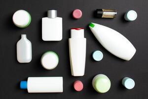 Group of plastic bodycare bottle Flat lay composition with cosmetic products on colored background empty space for you design. Set of White Cosmetic containers, top view with copy space photo