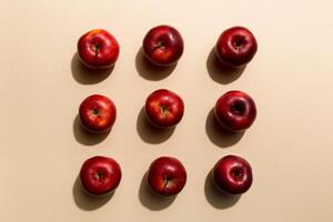 Many red apples on colored background, top view. Autumn pattern with fresh apple above view photo