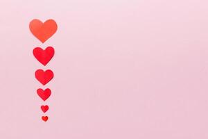 Valentine day background with red hearts, top view with copy space photo