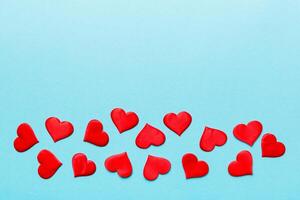 Valentine day background with red hearts, top view with copy space photo