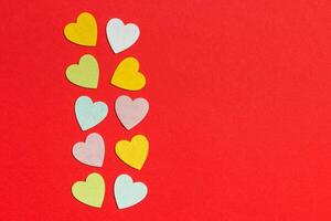 Top view of wooden hearts on colorful background with copy space. Romantic concept. St Valentine's Day photo