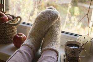 Woman relaxing with cup of coffee at home. photo