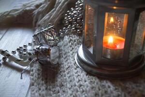 Burning candle and christmas decoration. photo