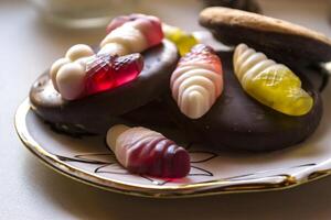 Sweet candies in a saucer. photo