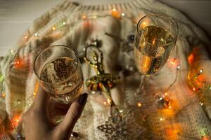 The glasses of champagne and christmas decoration. photo