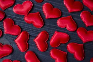 Red love hearts on a blue wooden background. Valentine's Day 2019. Background for greeting card. photo