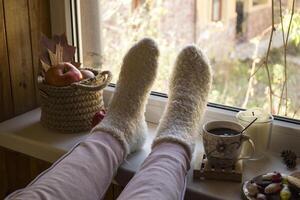 Woman relaxing with cup of coffee at home. photo