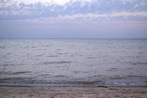 Beautiful sunset on the deserted beach. The place for rest and relaxation. photo