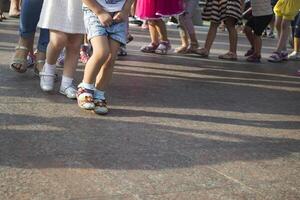 Children's feet one by one. photo