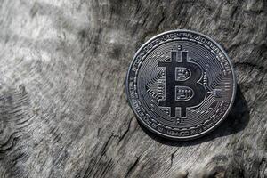 Silver coin of crypto currency on a wooden background. Silver bitcoin. photo