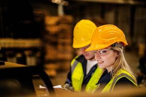 Factory engineer woman standing confidence to control panel switch. Worker works at heavy machine at industry factory. with machinery equipment plant technology. smart industry worker operating. photo