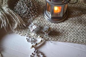 Burning candle and christmas decoration. photo