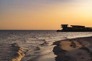 Sunset beach. Beautiful sunset on the deserted beach. photo